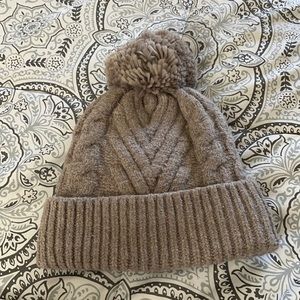 Taupe beanie with puff ball
